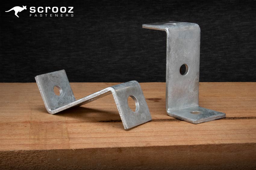 Z Brackets from Scrooz Fasteners. Z brackets on timber background