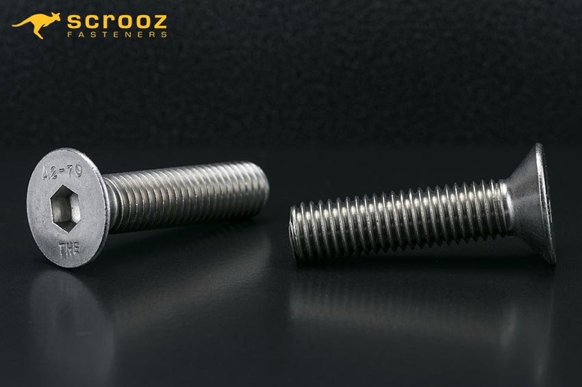 Countersunk head cap screws 304Gr main image. Two stainless screws on black background