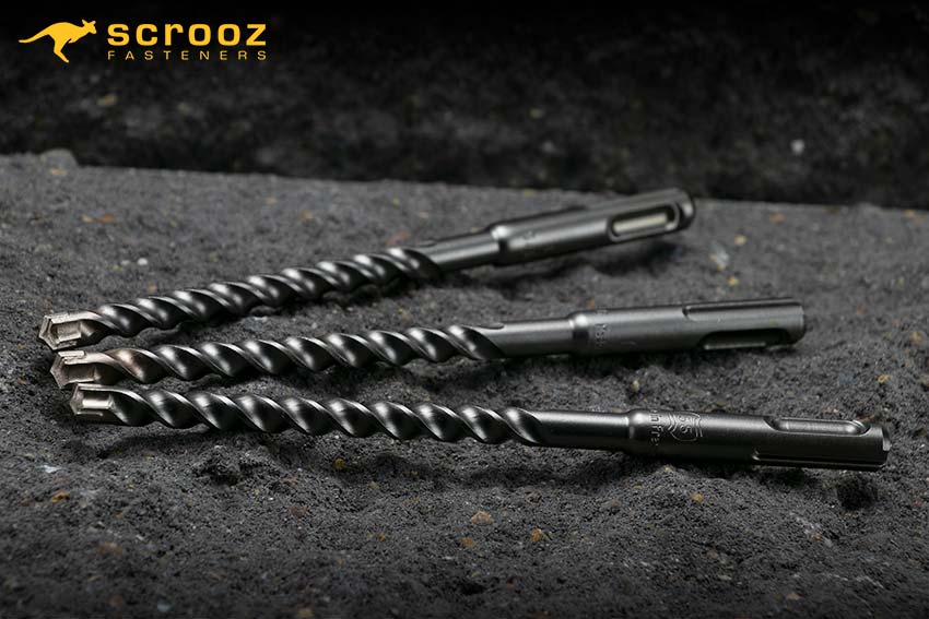 Drill Bits Masonry. Three of Scrooz Masonry Drill Bits on a concrete background.