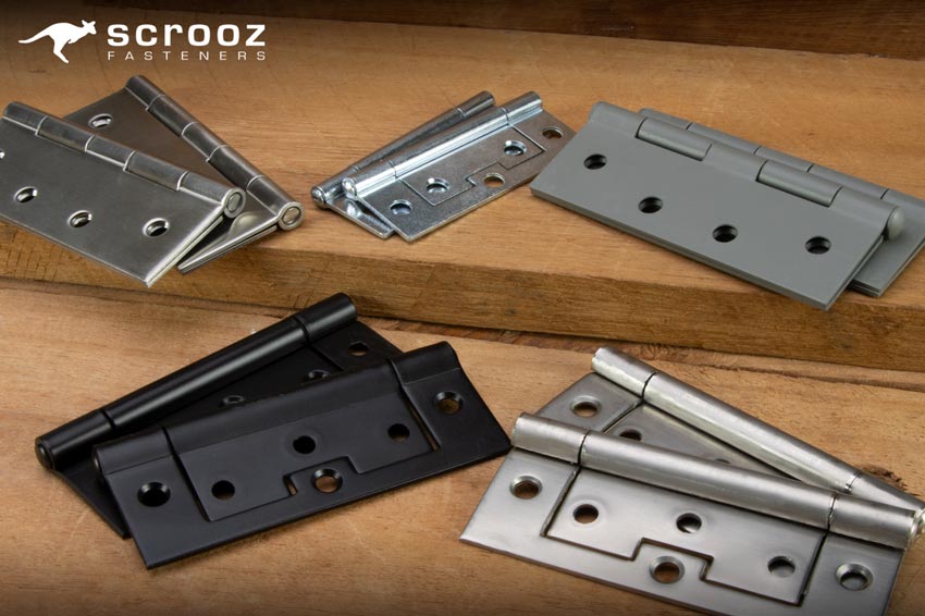 Door Hinges on wood background