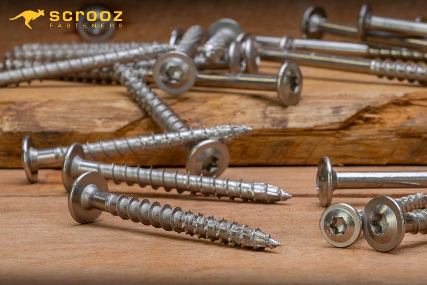 Landscape screws Stainless Steel Gr304 on wood background. Scrooz Fasteners Stainless Screws.
