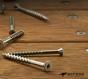 various square drive stainless steel decking screws fixed into hardwood merbau decking timber and spread loose on the deck boards