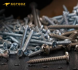 various panhead and countersunk zinc plated and stainless steel self tapping screws on some metalwork and sheet steel