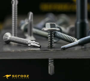 hex tek screws drilled and fastened into a metal plate surrounded by other metal self drill screws